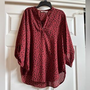 Lush maroon animal print blouse.